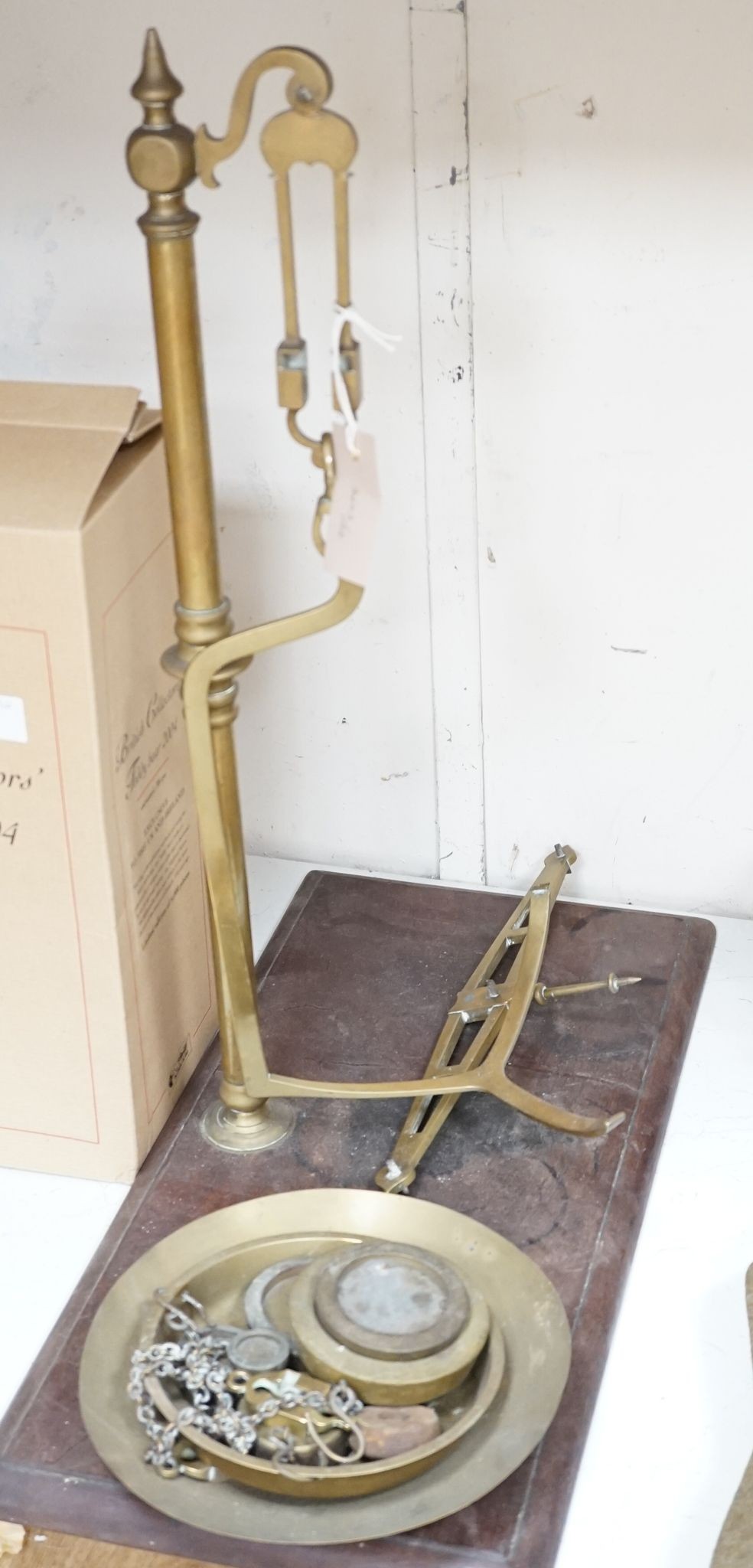 A Victorian brass pan scale., 60 cms high from base.